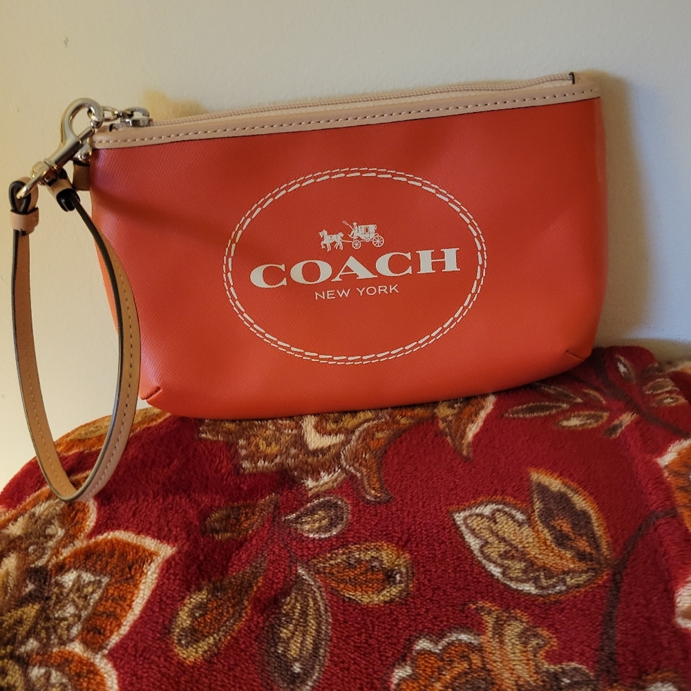 Coach Orange Horse and Carriage medium wristlet/ clutch.